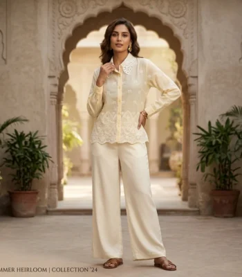 Cream colored women's vintage shirt featuring an intricate floral lace Peter Pan collar and geometric embroidery (1)