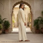 Cream colored women's vintage shirt featuring an intricate floral lace Peter Pan collar and geometric embroidery (4)