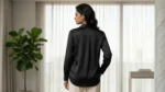 Elegant woman wearing a black satin full sleeve shirt with white buttons (1)