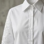 Front view of Aura Luxe white women's shirt with intricate tonal floral embroidery on sleeves (3)