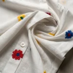 Premium white women's shirt with multi colored embroidered flowers and blue hearts (4)
