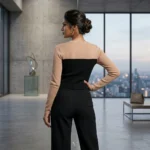 Woman wearing a premium beige and black faux layered knit top with leather strap accents (3)