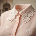 Women in pastel pink full sleeve shirt with white lace Peter Pan collar and geometric square motifs (2)