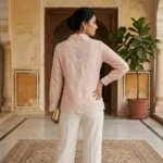 Women in pastel pink full sleeve shirt with white lace Peter Pan collar and geometric square motifs (3)