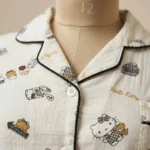 A premium off white Hello Kitty and cupcake print night suit with black piping and notched collar (1)