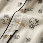 A premium off white Hello Kitty and cupcake print night suit with black piping and notched collar (4)