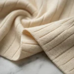 A sophisticated women's beige ribbed co ord set featuring a button down sleeveless vest and matching wide leg trousers (4)