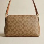 Coach women’s dome crossbody bag in khaki signature canvas with saddle leather trim and gold tone hardware (1)