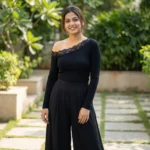 Elegant black long sleeve top for women featuring an asymmetric floral lace neckline and lace trimmed cuffs (2)