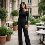 Elegant black long sleeve top for women featuring an asymmetric floral lace neckline and lace trimmed cuffs (3)