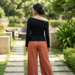 Elegant black long sleeve women's top with asymmetric floral lace neckline detail (3)