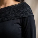 Elegant black long sleeve women's top with asymmetric floral lace neckline detail (4)