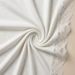 Elegant women’s off shoulder white top featuring intricate lace trim neckline and long sleeves (5)