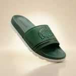 Front view of Lacoste green slides with oversized crocodile logo and white sole (5)