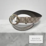 Gucci Blondie GG Supreme beige and ebony canvas belt with gold toned interlocking G logo buckle for women (1)