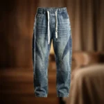 Light blue acid wash baggy jogger jeans with dark blue side panels and white drawstrings (3)