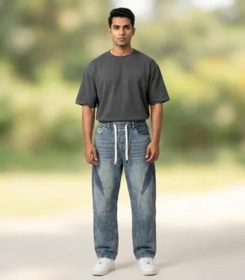 Light blue acid wash baggy jogger jeans with dark blue side panels and white drawstrings (4)