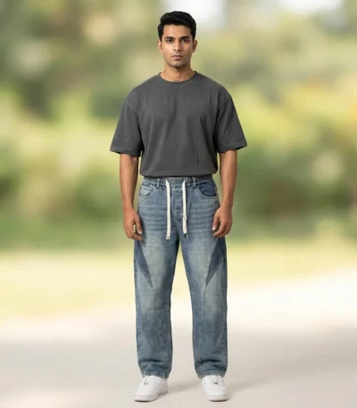 Light blue acid wash baggy jogger jeans with dark blue side panels and white drawstrings (4)
