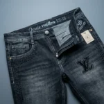 Louis Vuitton Men’s Slim Fit Dark Wash Denim Jeans with Studded LV Logo Detail (1)