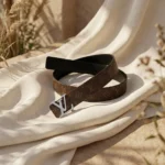 Louis Vuitton women's reversible monogram belt with silver LV initiales buckle on a stone pedestal (5)