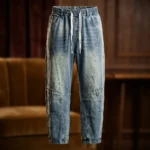 Men's light wash paneled baggy jogger jeans with white drawstring and elastic waistband (6)