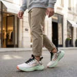 Men's lightweight breathable running shoes in mint green and white with orange accents (5)