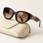 Miu Miu Glimpse dark tortoise shell cat eye sunglasses with gold logo hardware and cream leather case (2)
