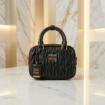 Miu Miu Matelassé black nappa leather top handle bag with gold logo and padlock (2)