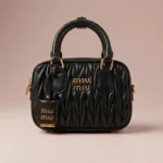 Miu Miu Matelassé black nappa leather top handle bag with gold logo and padlock (3)