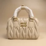 Miu Miu Wander Matelassé nappa leather mini bag in cream with gold logo (5)