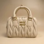 Miu Miu Wander Matelassé nappa leather mini bag in cream with gold logo (6)