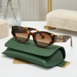 Miu Miu dark havana tortoiseshell oval sunglasses with gold logo hardware and green velvet case (7)