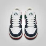 Nike SB Dunk Low sneaker featuring navy blue toe overlays, forest green heel panels, and a red bordered swoosh on a marble surface (5)