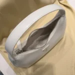 Prada Cleo white brushed leather hobo bag with iconic triangle logo and scrunchie handle detail (2)