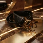 Premium black textured leather women's belt with polished gold interlocking G style buckle (1)