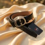 Slim black women's belt with a silver oval monogram buckle (2)
