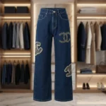 Woman wearing Chanel high waisted wide leg indigo denim jeans with pearl CC logo embellishments (3)