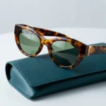 Woman wearing Saint Laurent tortoiseshell cat eye sunglasses with gold YSL logo on temple (4)