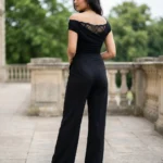 Woman wearing a premium black off shoulder top (1)