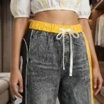 Women's High Waisted Distressed Grey Denim Joggers with Yellow Elastic Waistband and Side Typography Striping (4)