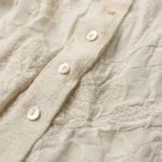 Women's bohemian two piece set featuring an ivory floral embroidered shirt layered under a blue denim style vest with gold ethnic embroidery (3)