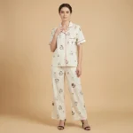 Women’s cream colored notched collar pajama set with whimsical animal print and red piping details (3)
