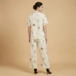 Women’s cream colored notched collar pajama set with whimsical animal print and red piping details (4)