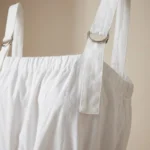 Women's crisp white Korean parachute style maxi dress featuring adjustable square neckline and utility cargo pockets (4)