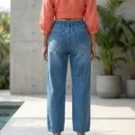 Women's high waisted blue jeans featuring white pearl and rhinestone bow patterns on the front legs (4)