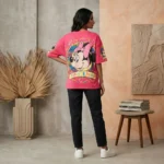 Women's hot pink oversized t shirt featuring a Minnie Mouse graphic with leopard print and pink bead embellishments (1)
