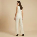 Women's ivory ribbed knit co ord set featuring a V neck sleeveless waistcoat with embossed gold buttons and matching wide leg trousers (4)