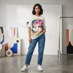 Women's oversized white t shirt featuring a retro Minnie Mouse graphic print with pink bow and leopard accents (1)