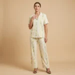 Women's short sleeve pajama set with pastel stripes and yellow teddy bear illustrations (1)