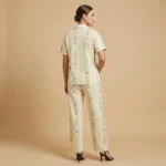 Women's short sleeve pajama set with pastel stripes and yellow teddy bear illustrations (2)